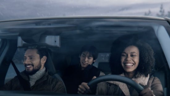 Three passengers riding in a vehicle and smiling | Banister Nissan of Chesapeake in Chesapeake VA